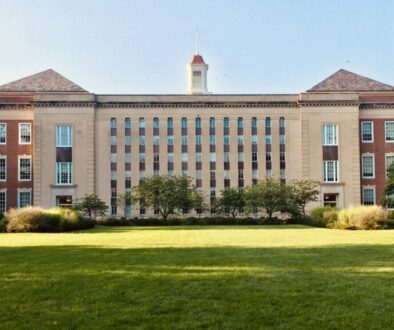 Brick school campus exterior under a clear North Texas sky with lawn and trees—editorial header for Gunter ISD parent guide