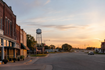 Van Alstyne, Texas main street and highway corridor at sunrise, with distant growth on the horizon