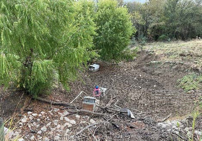 Mustang Creek bank with willow trees at the northern line of the Bryson Ranch property in Pilot Point TX