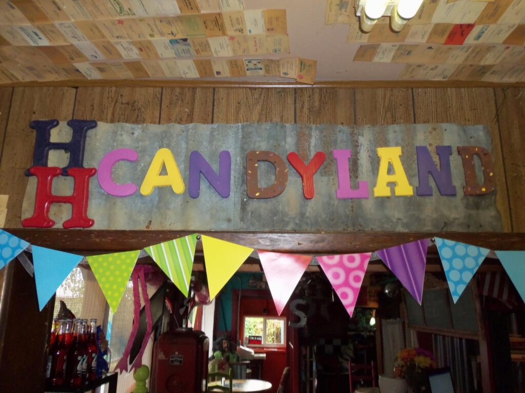 HH Candyland sign and pennant banner inside Hickory House Bar-B-Que Denison