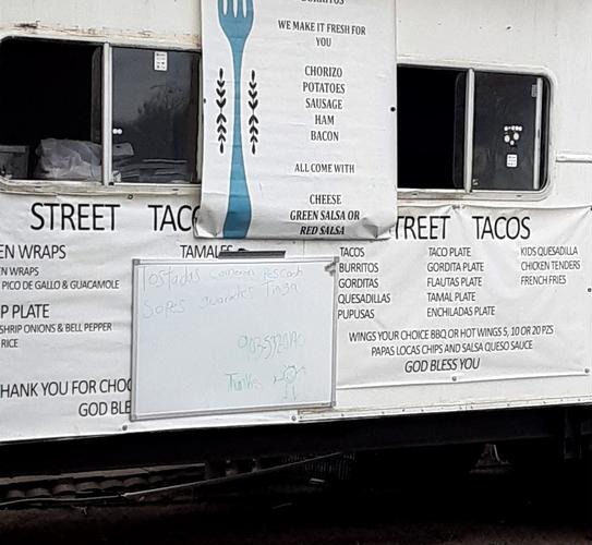 Street Tacos trailer in Howe with a menu board listing tacos, burritos, gorditas, quesadillas, pupusas, and plates