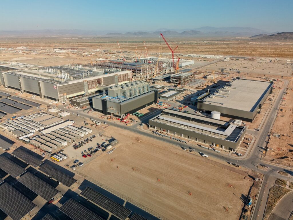 Aerial view of TSMC's Fab 21 campus under construction in Phoenix, Arizona, with cranes and fab buildings